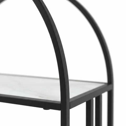 Close-up of a black metal shelving unit with a white marble-look shelf, showing the frame and arch design against a white background.