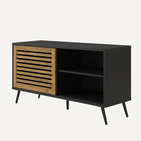 Black and wood TV unit with sliding barn door in a living room setting